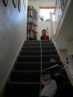 D constructed a marble run down the stairs using the skyrail kit